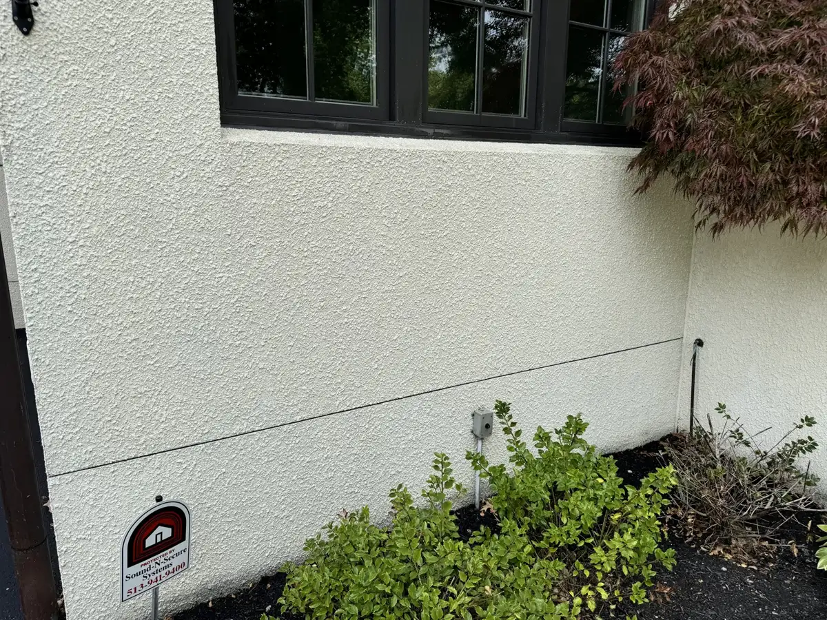 Bright, clean stucco wall after professional house washing by Skyline