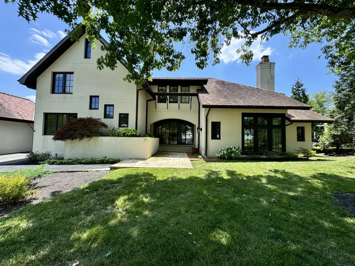 Stucco Tudor-style home exterior, cleaned
